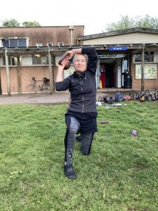 Woman performs the kettlebell halo exercise