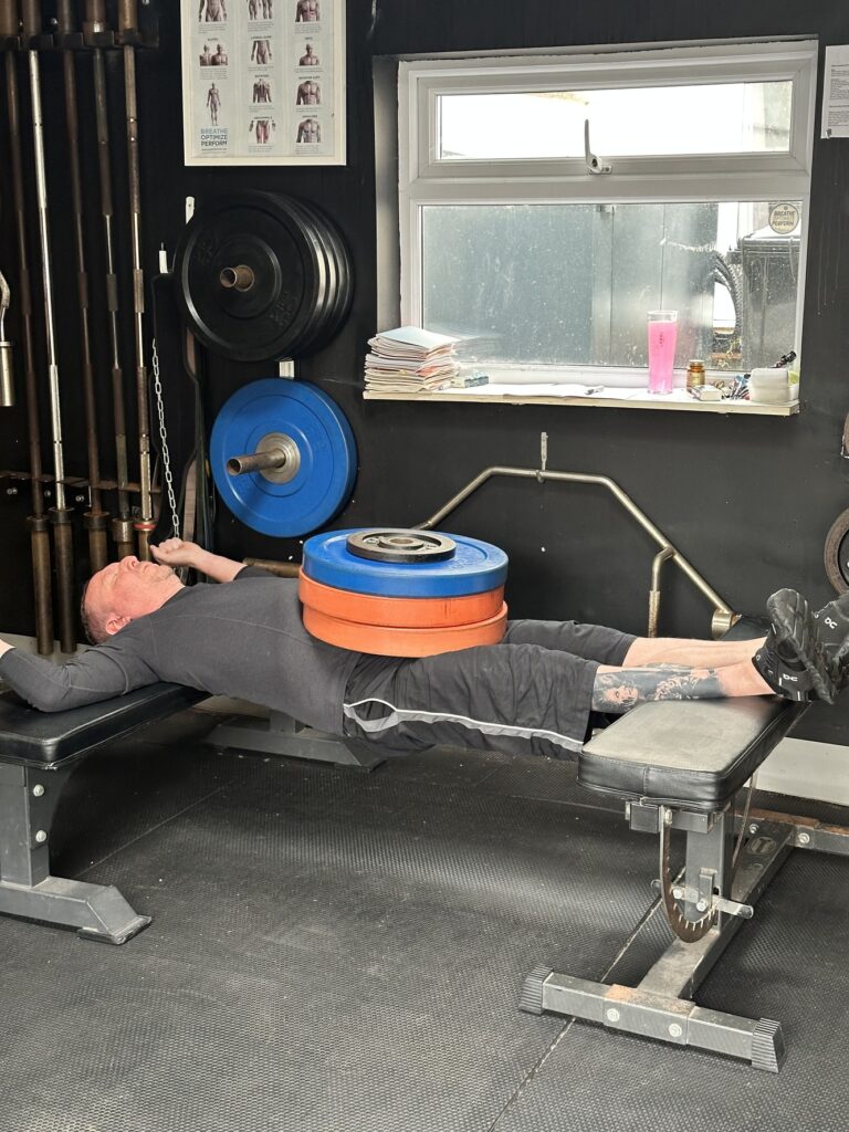 Dave performing the chinese plank with 75kg